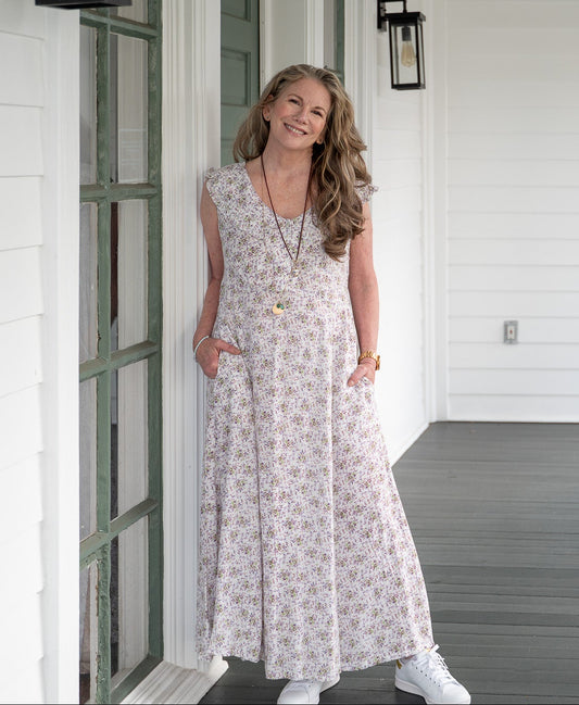 Melissa wearing white sleeveless floral dress