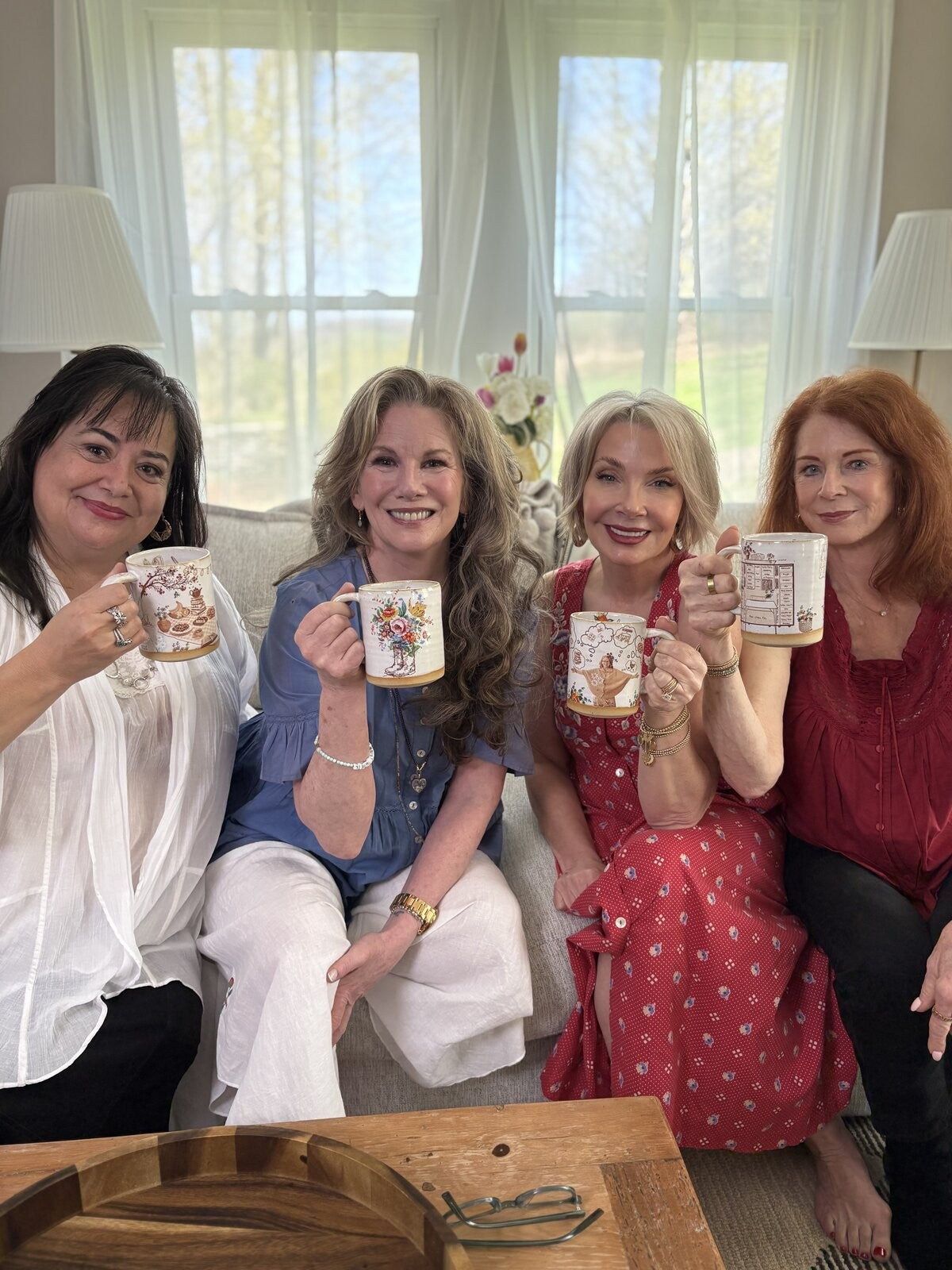 Friends sharing coffee on the sofa